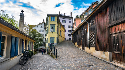 Street amidst buildings against sky