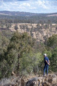 Rear view of man on landscape against mountain