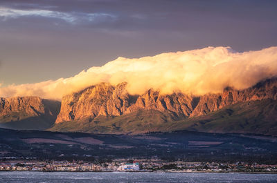 Scenic view of snowcapped mountains during sunset