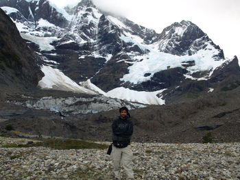 Woman standing on snow covered landscape