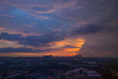 High angle view of buildings against sky at sunset