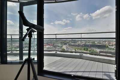 Bridge against sky seen through glass window