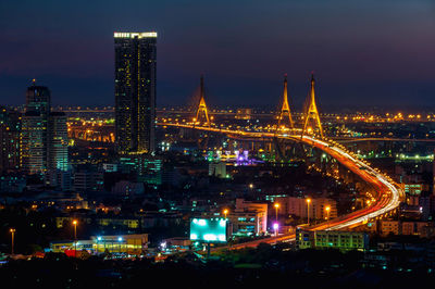 Illuminated buildings in city at night