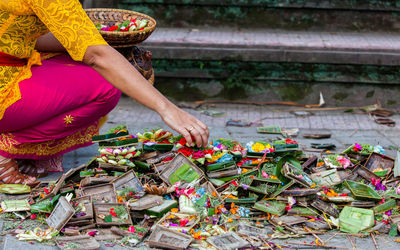 Midsection of woman working in traditional clothing