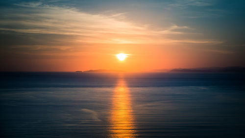 Scenic view of sea against romantic sky at sunset in flores