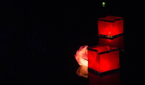 Close-up of illuminated christmas lights against black background