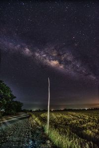 Scenic view of field against sky at night