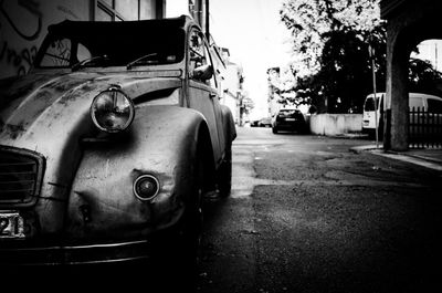 Close-up of abandoned car on street