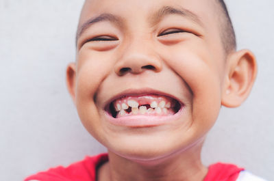 Close-up portrait of smiling cute boy