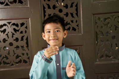 Portrait of smiling boy at home