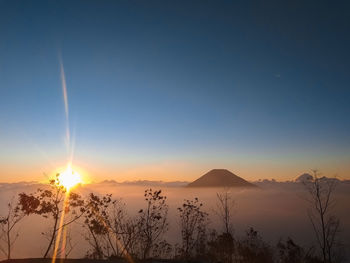 Scenic view of silhouette landscape against sky during sunset