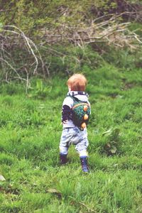 Child wandering into the woods exploring