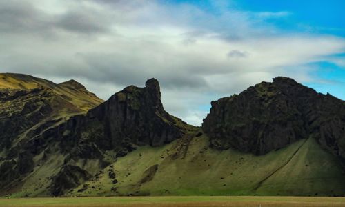 Panoramic view of rocky mountains against sky