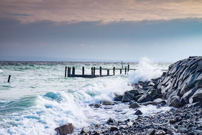 The wild storm damaged port pier at old fishing village vitt. the baltic sea coast, ruegen, germany