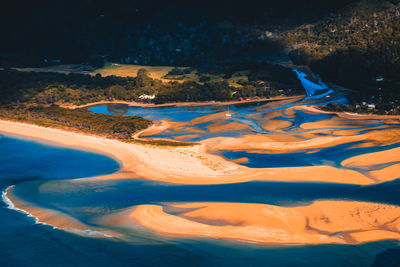 High angle view of sea shore during sunset