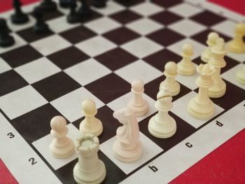 High angle view of chess pieces on table