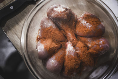 High angle view of marinated meat in container