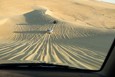 Tilt image of car on desert land in safari adventure