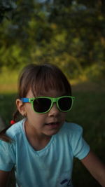 Smiling wearing sunglasses outdoors