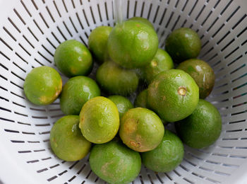 High angle view of apples in basket on table