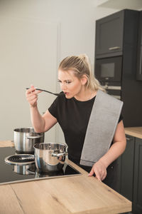 Woman cooking food at home