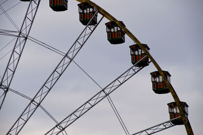 Low angle view of ferris wheel against sky