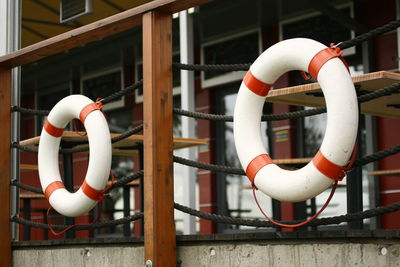 Inflatable ring hanging on railing by building