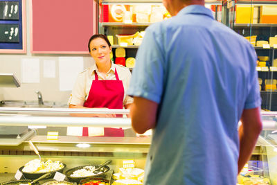 Full length of man working in store