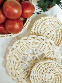 High angle view of oranges in basket on table