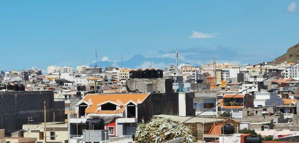 Buildings in city against sky