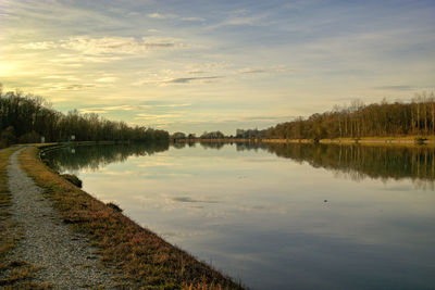 Scenic view of lake against sky during sunset