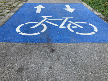 High angle view of arrow sign on road