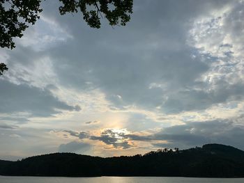 Scenic view of silhouette mountains against sky at sunset