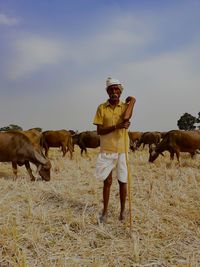 Full length of man standing on field