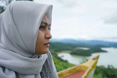 A woman sitting looking at nature