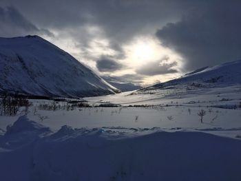 Scenic view of mountains against sky during winter