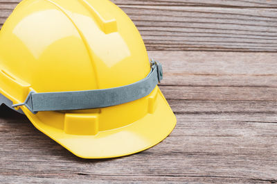 Close-up of yellow hat on table