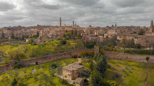 High angle view of buildings in city against sky