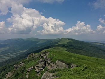 Scenic view of landscape against cloudy sky