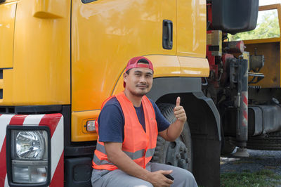 Portrait of man working in bus