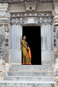 Statue of woman outside building