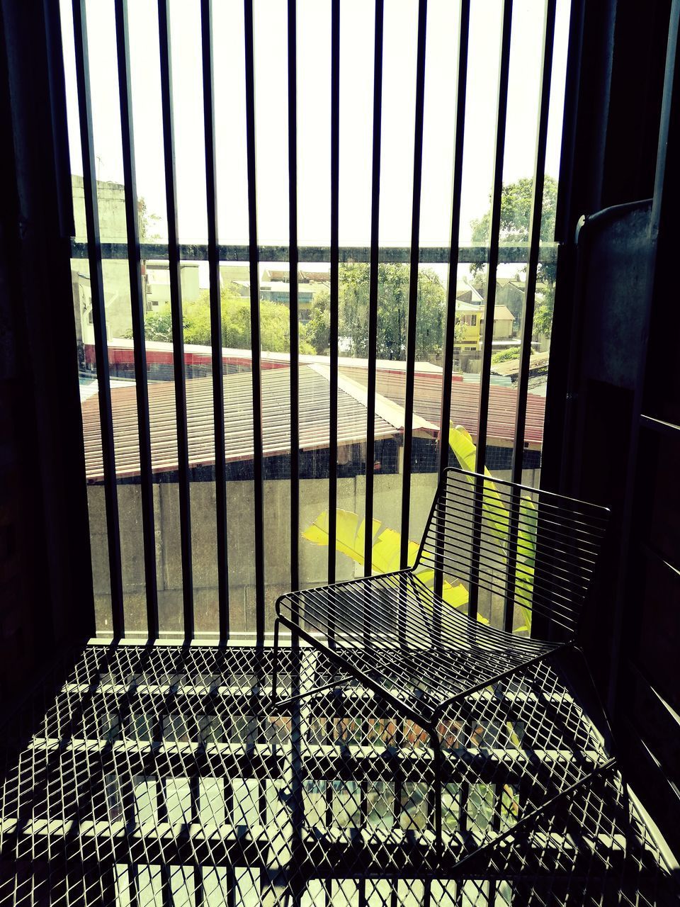 METAL GRATE IN GLASS WINDOW