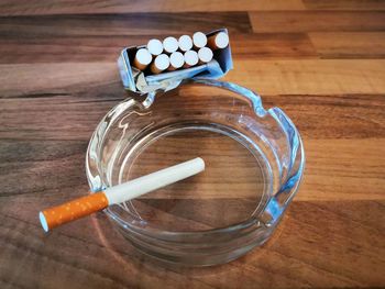 High angle view of cigarette on table