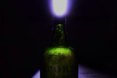 Close-up of illuminated lamp at night