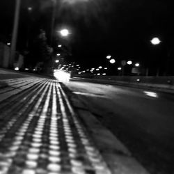 Surface level of illuminated street light at night