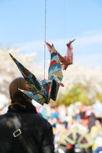 Close-up of colorful origami hanging at public park