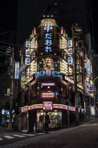 Low angle view of illuminated building at night