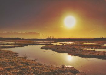 Scenic view of sea at sunset