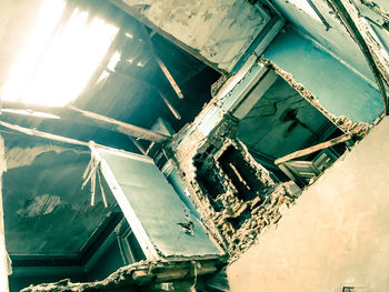 Low angle view of abandoned building against sky