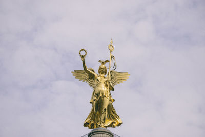 Low angle view of statue against sky